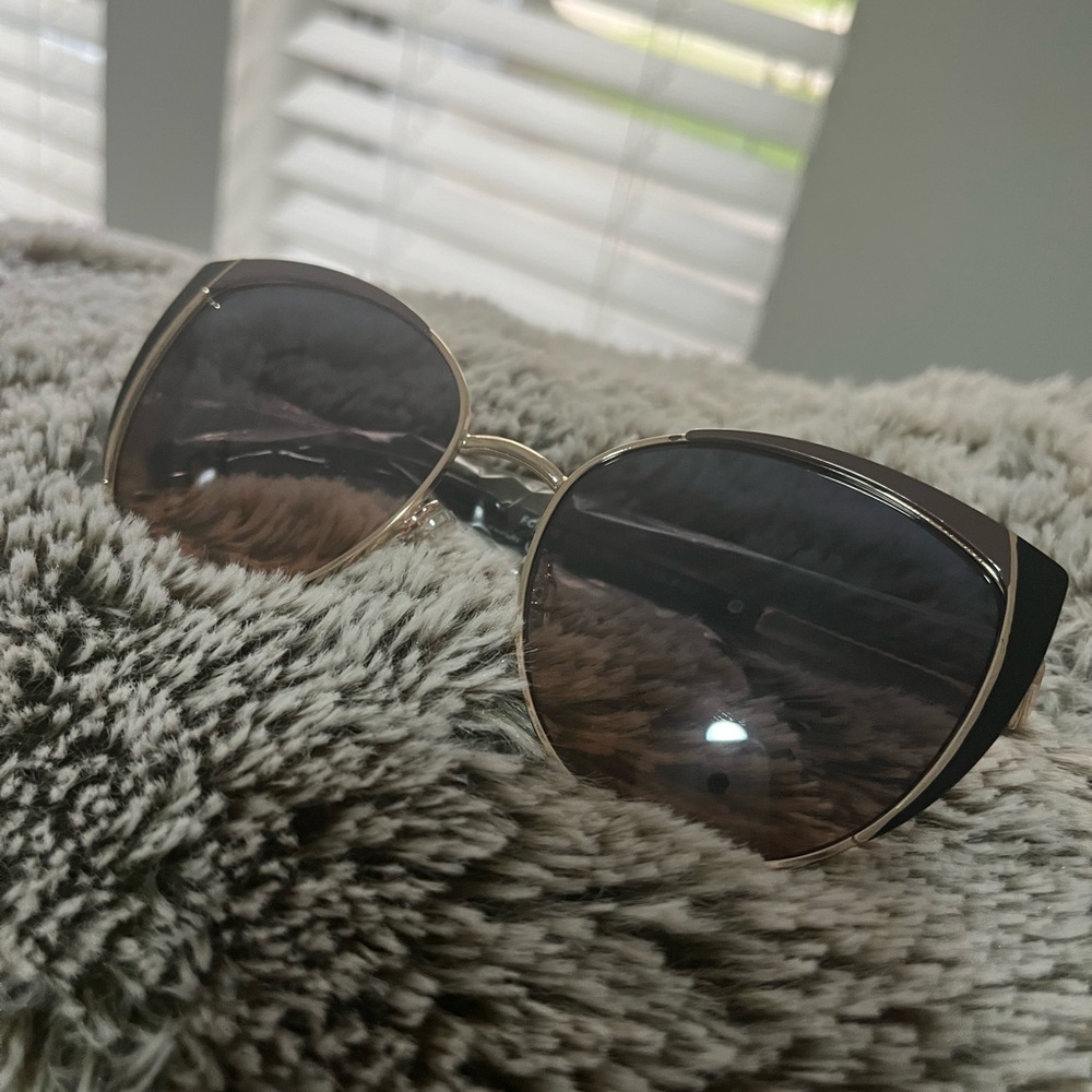 Black and dark purple mauve frame with amber lens